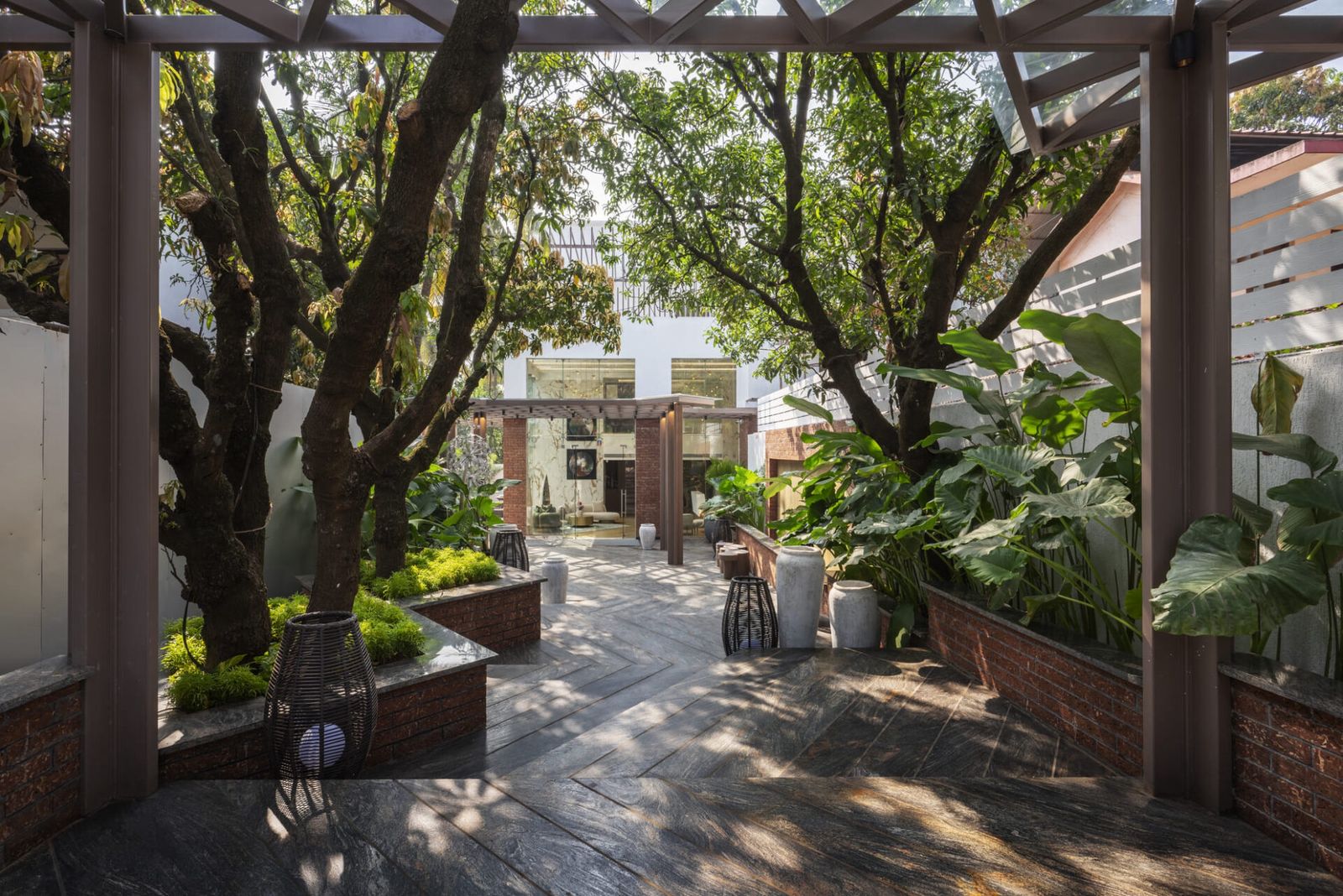 Anjuna garden path — pergola, slate paving, mature trees